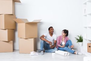 Image of a first time buyer couple in their new home