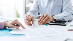 Image of two men going through a mortgage document