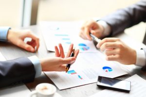 Image of two men discussing share equity