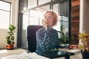 Image of a woman thinking to remortgage or not to remortgage
